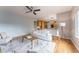Open concept living room with hardwood floors, ceiling fan, and a view of the kitchen at 2822 Flint Ct, Superior, CO 80027