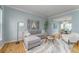 Cozy living room with hardwood floors, comfortable seating, and a seamless flow to the dining area at 2822 Flint Ct, Superior, CO 80027