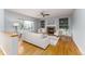 Bright living room with hardwood floors, fireplace, built-in shelves, and large windows that provide natural light at 2822 Flint Ct, Superior, CO 80027