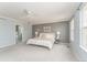Spacious main bedroom featuring a ceiling fan, neutral carpet, and an ensuite bathroom at 2822 Flint Ct, Superior, CO 80027
