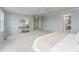 Spacious main bedroom features soft carpet, soothing wall color and an ensuite bathroom entrance at 2822 Flint Ct, Superior, CO 80027