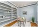 Stylish home office with built-in shelving, neutral décor, and natural light, creating a functional workspace at 2822 Flint Ct, Superior, CO 80027