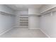 Walk-in closet provides ample storage with custom shelving and rods at 2822 Flint Ct, Superior, CO 80027