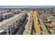 Scenic aerial view of townhomes next to landscaped walking path at 400 E Fremont Pl # 205, Littleton, CO 80122