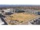 Overhead view of neighborhood featuring central green space, playground, and apartments at 400 E Fremont Pl # 205, Littleton, CO 80122
