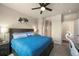 Bright bedroom boasts a ceiling fan, ensuite bathroom, and relaxing atmosphere at 400 E Fremont Pl # 205, Littleton, CO 80122