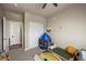 Cozy bedroom with a closet, neutral colors, and playful decor at 400 E Fremont Pl # 205, Littleton, CO 80122