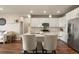 Charming kitchen with a center island, stainless steel appliances, and ample storage space at 400 E Fremont Pl # 205, Littleton, CO 80122