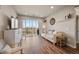 Cozy living room showcasing a sliding door leading to a balcony with a scenic view at 400 E Fremont Pl # 205, Littleton, CO 80122