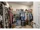 Spacious walk-in closet with ample storage shelving and hanging space for organization at 400 E Fremont Pl # 205, Littleton, CO 80122