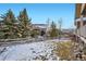 Charming backyard with a wooden fence and evergreen trees against a beautiful mountain backdrop at 461 Saber Creek Dr, Monument, CO 80132