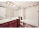 Bright bathroom featuring a vanity with drawers and a shower/tub combination with white tiles at 461 Saber Creek Dr, Monument, CO 80132