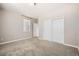 Bright bedroom features neutral paint, a large window with blinds, and a spacious closet with bi-fold doors at 461 Saber Creek Dr, Monument, CO 80132