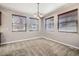 Bright dining area with three windows and neutral carpeting at 461 Saber Creek Dr, Monument, CO 80132
