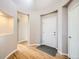 Inviting foyer with hardwood floors, neutral paint, archways and a white front door at 461 Saber Creek Dr, Monument, CO 80132