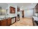 Modern kitchen featuring stainless steel appliances, wooden cabinets and hardwood floors at 461 Saber Creek Dr, Monument, CO 80132