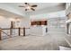 View of the living room with a view to the kitchen and stairway at 461 Saber Creek Dr, Monument, CO 80132