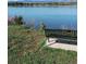 Beautiful lake view with bench, capturing the essence of lakeside tranquility and the beauty of the surrounding nature at 4901 Redwood Dr, Littleton, CO 80123