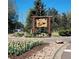 Welcome to Bow Mar sign surrounded by colorful tulips, creating a vibrant and inviting entrance to the community at 4901 Redwood Dr, Littleton, CO 80123