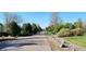 Scenic street view lined with mature trees, showcasing a tranquil path for walking and enjoying the natural surroundings at 4901 Redwood Dr, Littleton, CO 80123