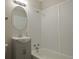 Bright bathroom with a combination tub/shower, updated vanity, and classic fixtures for a comfortable experience at 1750 Jamaica St, Aurora, CO 80010