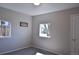 Well-lit bedroom with neutral walls, carpeted floor, and dual windows providing outdoor views at 1750 Jamaica St, Aurora, CO 80010