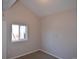 Cozy bedroom featuring neutral walls, carpet flooring, and a window offering natural light at 1750 Jamaica St, Aurora, CO 80010