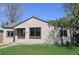 Charming single-story home with a well-maintained lawn and classic curb appeal in a residential neighborhood at 1750 Jamaica St, Aurora, CO 80010