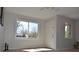 Bright living room with large windows, tile floors, and ample natural light at 1750 Jamaica St, Aurora, CO 80010