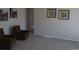 Cozy living area with plush carpeting, comfortable armchairs, and tasteful wall decor at 1750 Jamaica St, Aurora, CO 80010