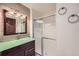 Bathroom featuring an updated vanity and glass enclosed shower at 23566 Pondview Pl # F, Golden, CO 80401