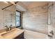 Modern bathroom featuring a tiled shower and tub combo at 23566 Pondview Pl # F, Golden, CO 80401