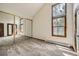 Bright bedroom featuring vaulted ceiling and large mirrored closet at 23566 Pondview Pl # F, Golden, CO 80401