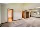 Bright bedroom featuring vaulted ceiling and convenient ensuite access at 23566 Pondview Pl # F, Golden, CO 80401