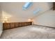 Large bonus room with skylights and built-in storage and kitchenette at 23566 Pondview Pl # F, Golden, CO 80401
