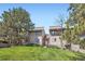Inviting exterior view of a well-maintained townhome with lush lawn and mature trees at 23566 Pondview Pl # F, Golden, CO 80401