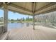 Picturesque gazebo with wood flooring overlooking a tranquil lake at 23566 Pondview Pl # F, Golden, CO 80401