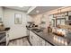 Modern kitchen boasts stainless steel appliances, gray countertops, and opens to a dining and living area at 23566 Pondview Pl # F, Golden, CO 80401
