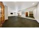Basement gym space features rubber floor, mirrors, and plenty of room for workout equipment at 850 E Radcliff Ave, Cherry Hills Village, CO 80113