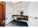 Modern bathroom featuring a unique black marble countertop, tiled flooring and ample lighting at 850 E Radcliff Ave, Cherry Hills Village, CO 80113