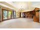 Spacious bonus room with built-in desk and shelving, with french doors leading to an outdoor deck at 850 E Radcliff Ave, Cherry Hills Village, CO 80113