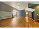 Bonus room with hardwood floors features architectural ceilings with accent lighting, and a neutral color palette at 850 E Radcliff Ave, Cherry Hills Village, CO 80113