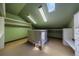 Bright walk-in closet with custom drawers, shelving, and great natural light from overhead skylights at 850 E Radcliff Ave, Cherry Hills Village, CO 80113