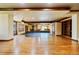 Open-concept living room boasting hardwood floors, wood trim, and a cozy window seat at 850 E Radcliff Ave, Cherry Hills Village, CO 80113