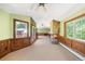 Spacious living room with natural light, built-in cabinets, and unique stone fireplace as a centerpiece at 850 E Radcliff Ave, Cherry Hills Village, CO 80113