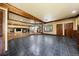 Expansive living area with slate flooring, wood trim, and a cozy fireplace for entertaining at 850 E Radcliff Ave, Cherry Hills Village, CO 80113