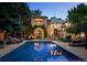 Stunning outdoor pool area with lush landscaping, stone accents, and a relaxing ambiance at 850 E Radcliff Ave, Cherry Hills Village, CO 80113