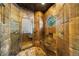 Unique shower stall with textured tile and glass door at 850 E Radcliff Ave, Cherry Hills Village, CO 80113