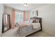 This is a cozy bedroom with plush carpet and soothing color palette at 10207 Xanadu St, Commerce City, CO 80022