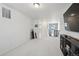 This is a bonus room with neutral carpet and wall-mounted tv at 10207 Xanadu St, Commerce City, CO 80022